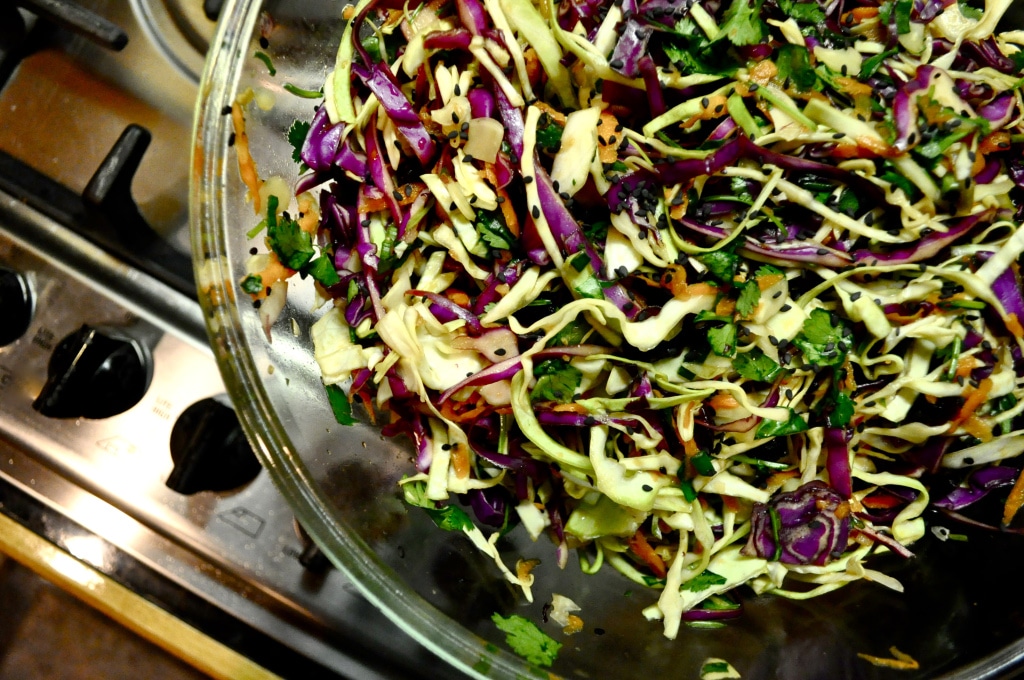 overhead view of bowl of prepared asian coleslaw on the stove