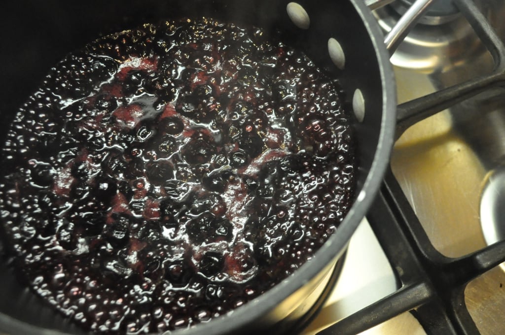 a pot of reduced blueberries and Cabernet Sauvignon on the stove 