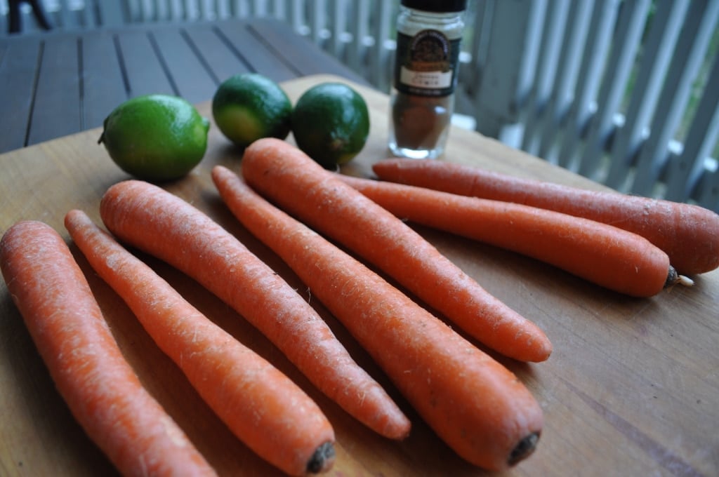 carrots and limes on a cutting board