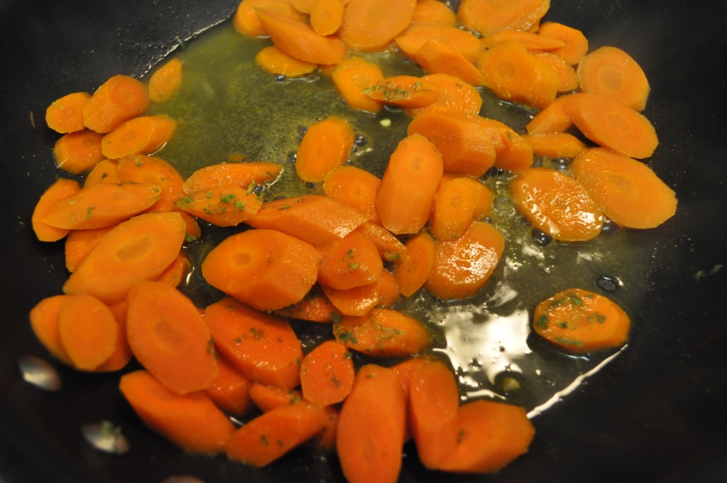 cumin lime carrots cooking in a pan