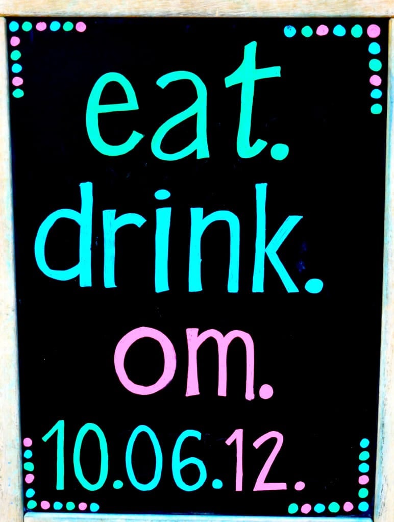 chalkboard sign that says "eat.drink.om." with the date 10.06.12 on it