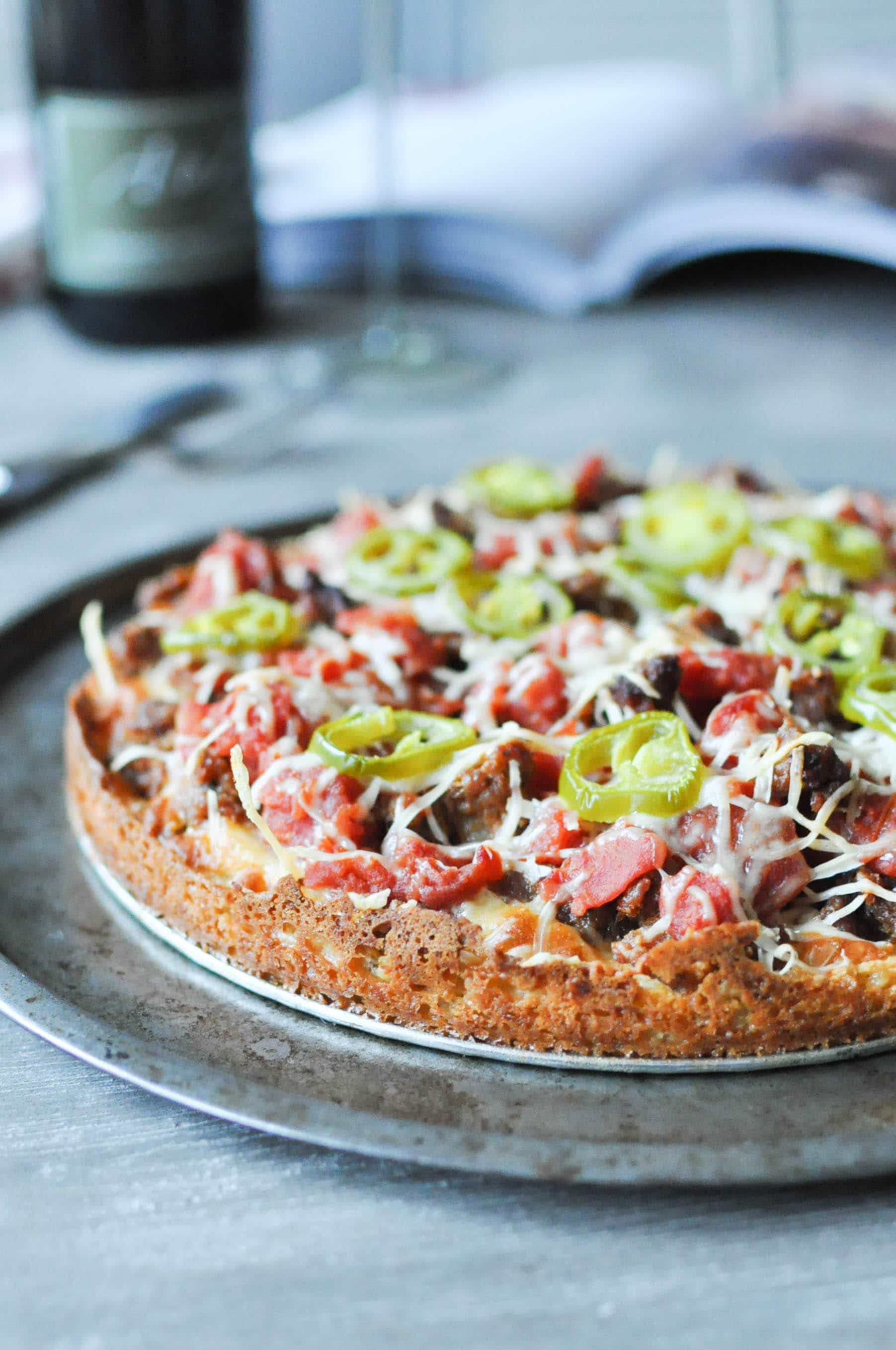 Chicago deep dish pizza on a round sheet pan