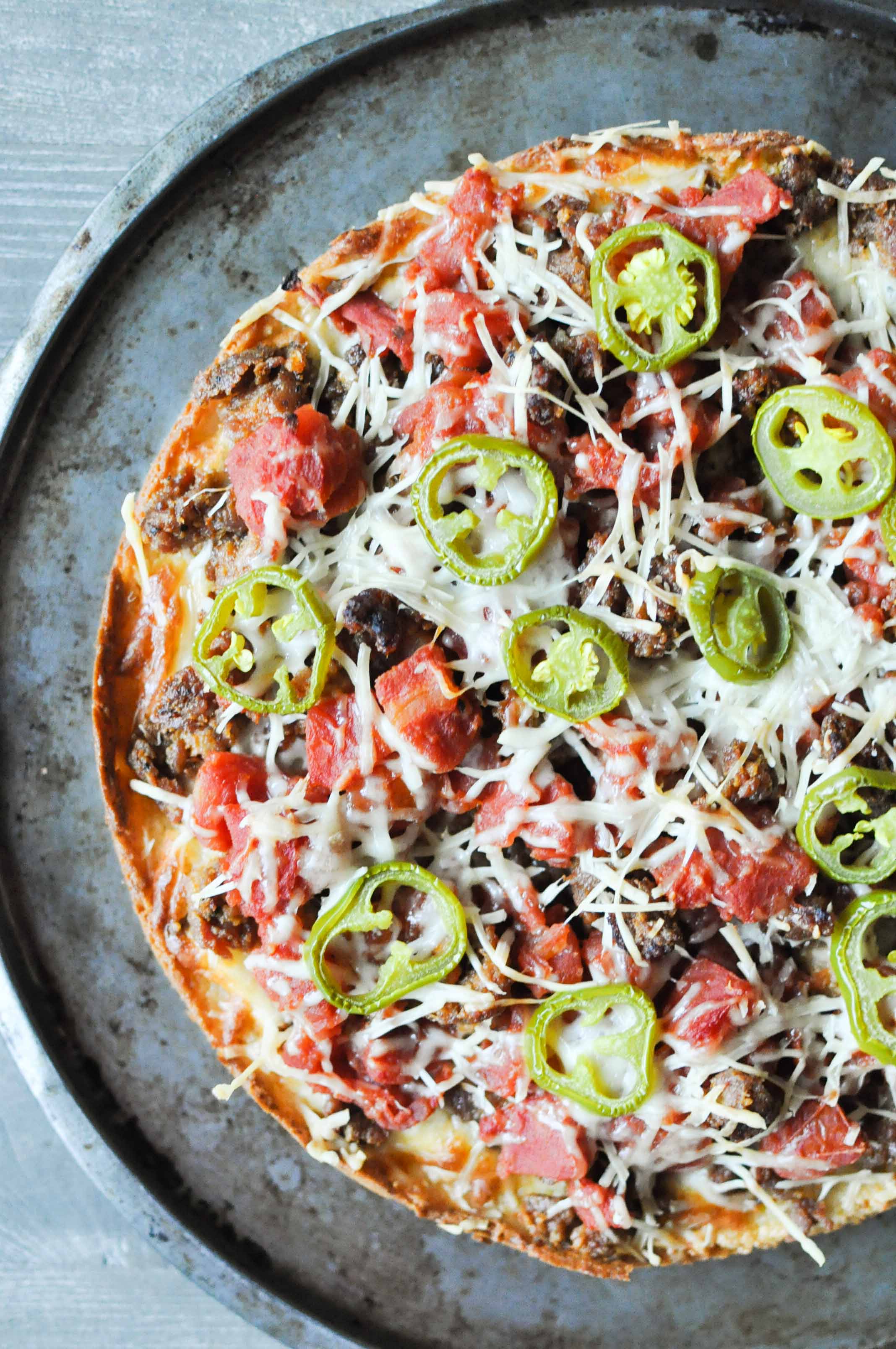 overhead view of a Chicago Deep-Dish Pizza on a round sheet pan