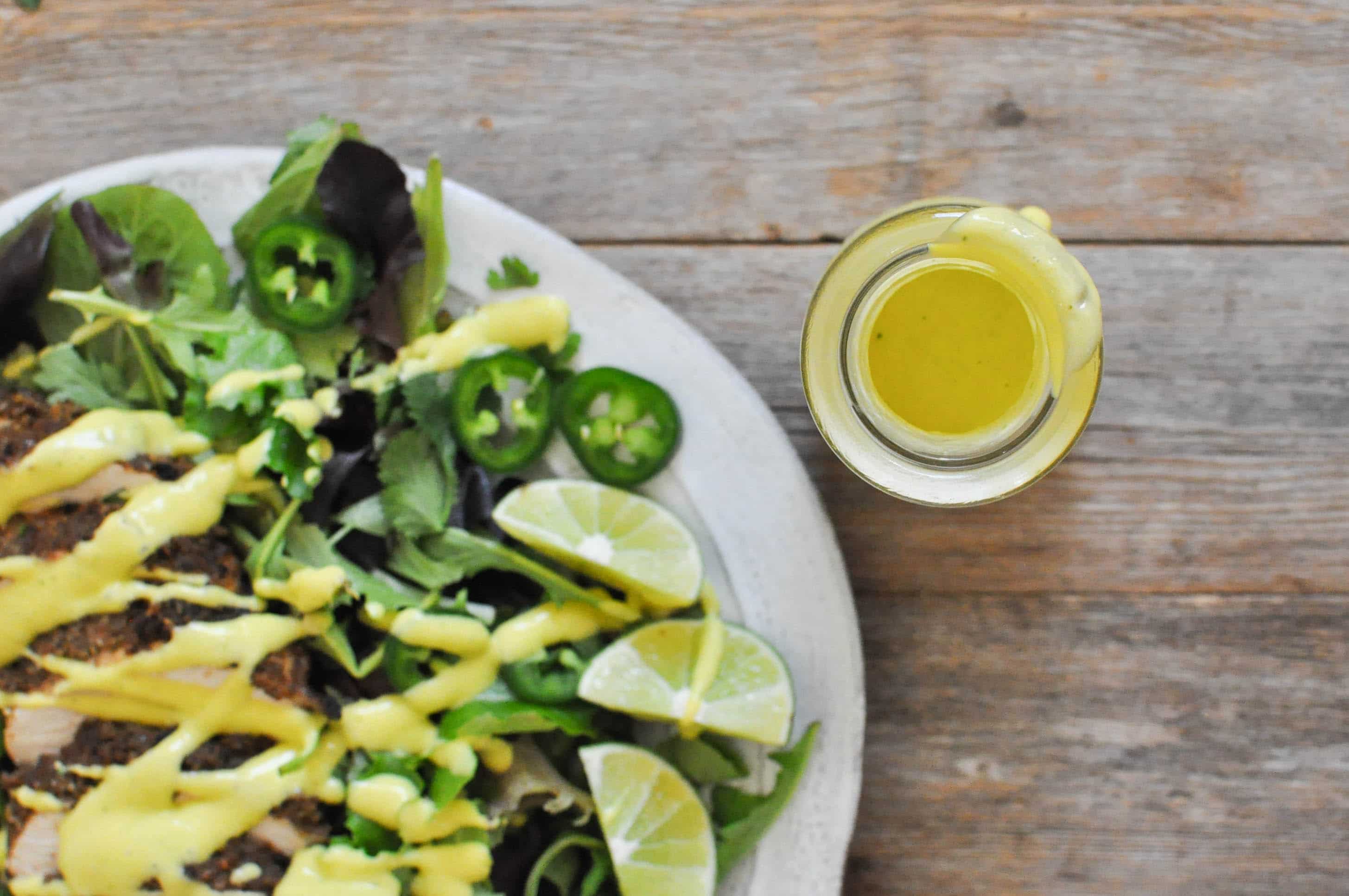 overhead view of Creamy Mango Jalapeno Dressing over a chicken salad