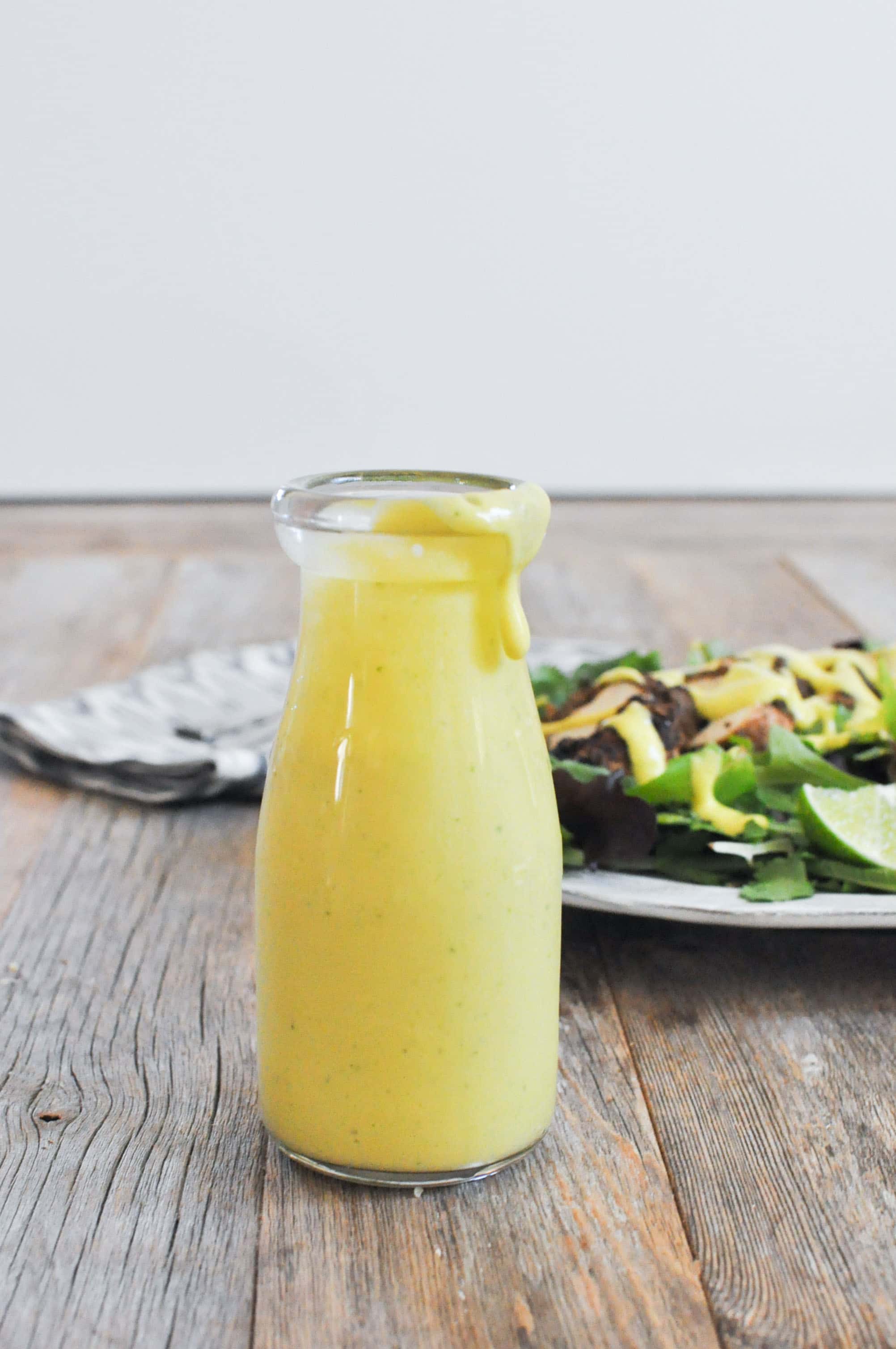 Creamy Mango Jalapeno Dressing in a glass carafe