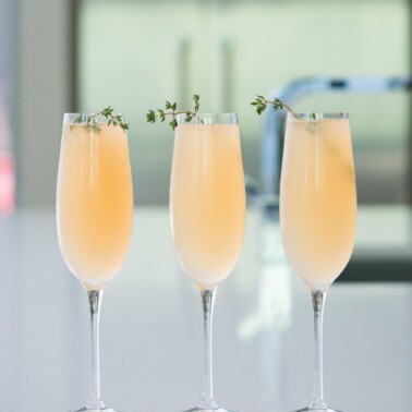 elderflower grapefruit mimosa in three champagne flutes