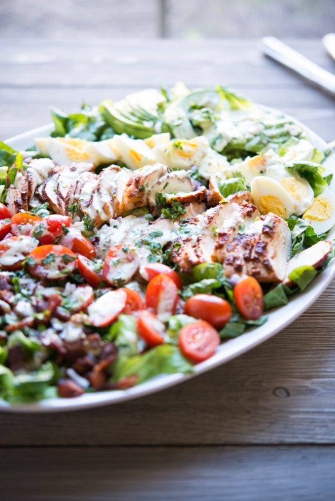 a plate of BBQ chicken Cobb salad with jalapeno ranch 