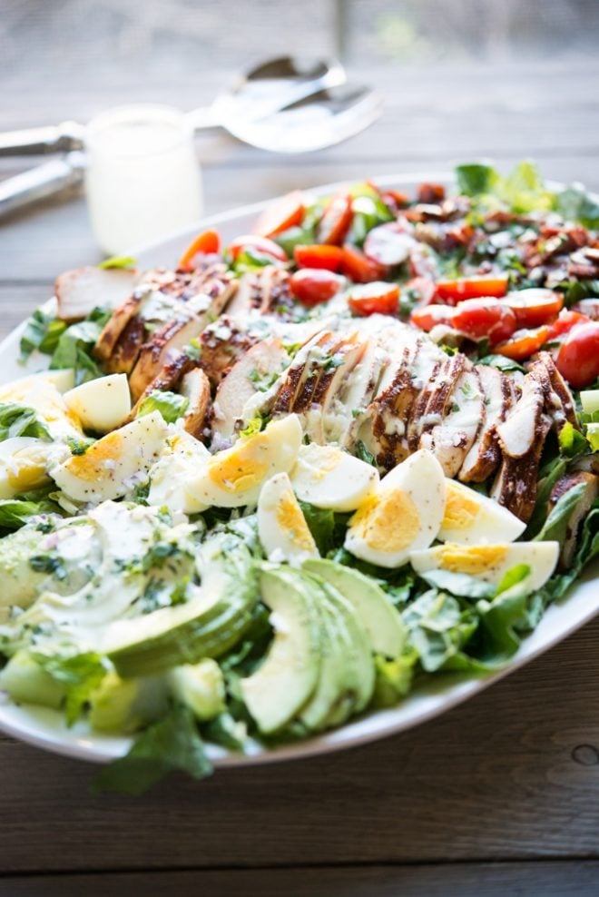 a plate of BBQ chicken Cobb salad with jalapeno ranch 