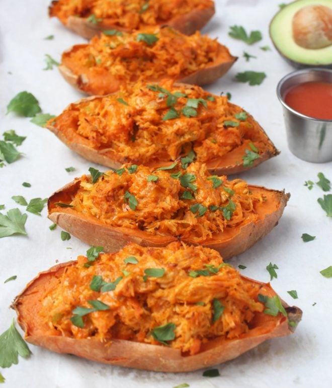 buffalo chicken twice baked sweet potatoes on a white serving platter