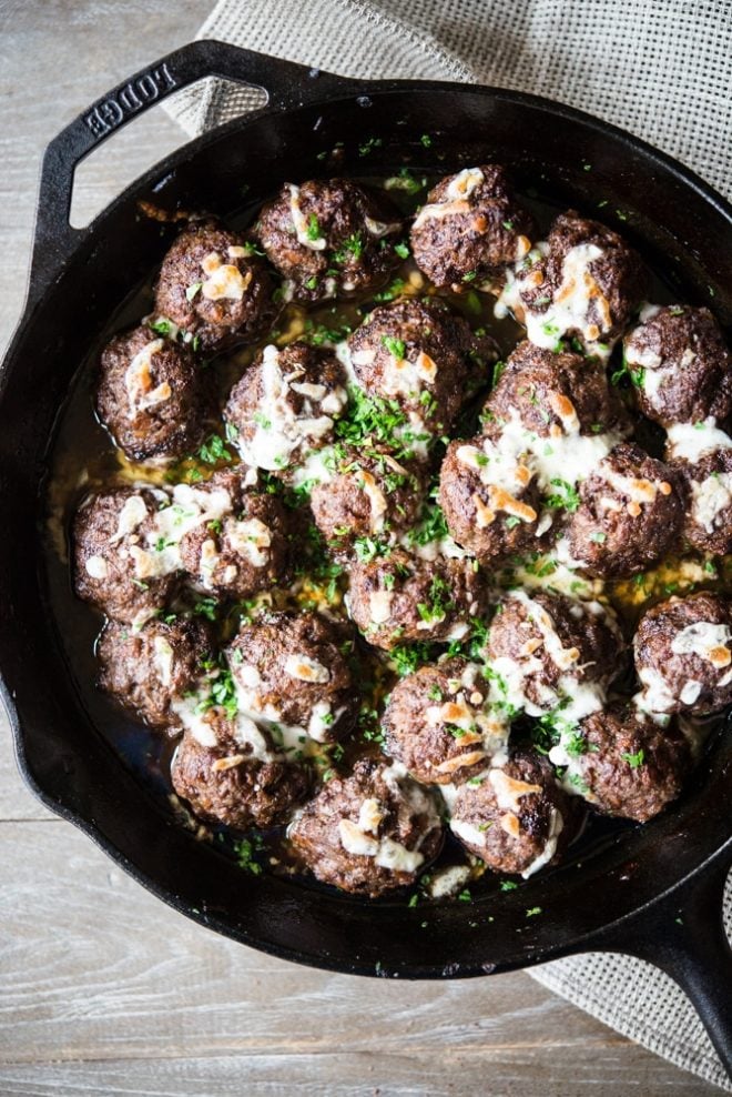french onion skillet meatballs in a cast iron pan