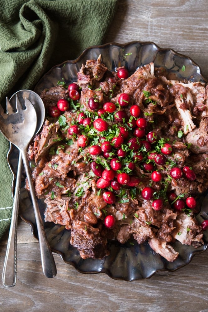 slow cooker cranberry pork shoulder topped with fresh cranberries - thanksgiving leftover recipes