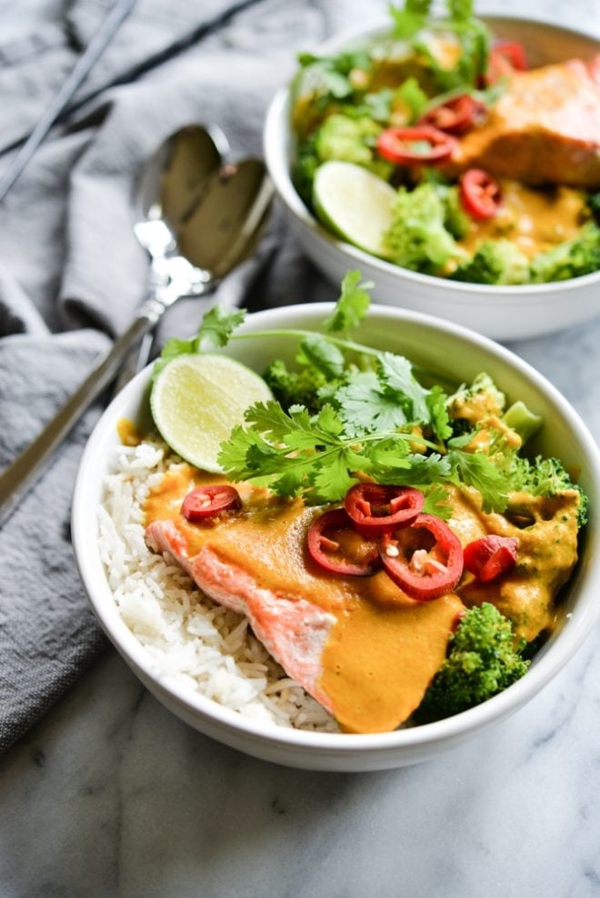 These easy bowl feature quick pan-seared salmon, an Indian coconut curry sauce, steamed broccoli, and rice for an easy one bowl dinner! | Fed & Fit