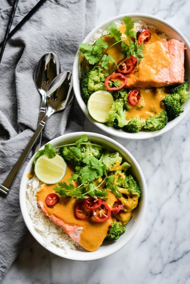 These easy bowl feature quick pan-seared salmon, an Indian coconut curry sauce, steamed broccoli, and rice for an easy one bowl dinner! | Fed & Fit