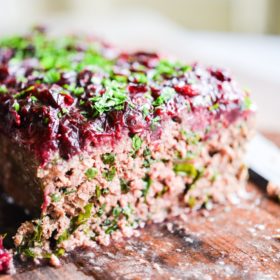 This Paleo bison cranberry meatloaf is the perfect healthy winter comfort food. It is incredibly flavorful, packs a big superfood punch, and the tangy cranberry sauce topping makes it perfectly festive for the holiday season!
