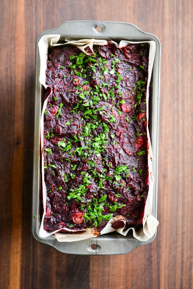 This Paleo bison cranberry meatloaf is the perfect healthy winter comfort food. It is incredibly flavorful, packs a big superfood punch, and the tangy cranberry sauce topping makes it perfectly festive for the holiday season!