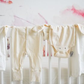 how I'm choosing safer baby products clothing draped over the crib