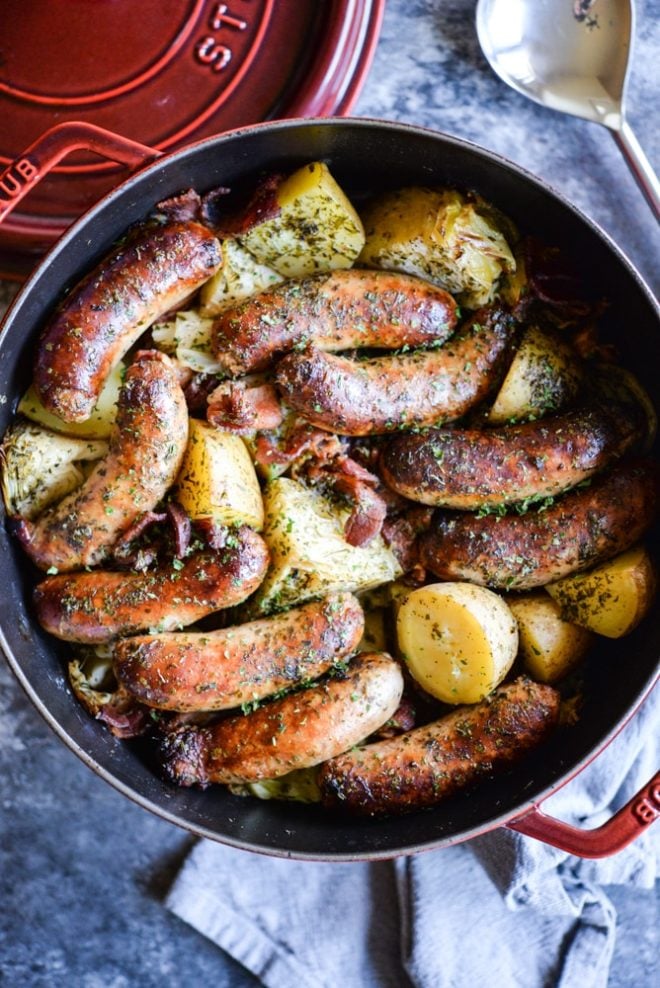 Dublin Coddle - sausage, potatoes, bacon, and cabbage in a red cast iron pot