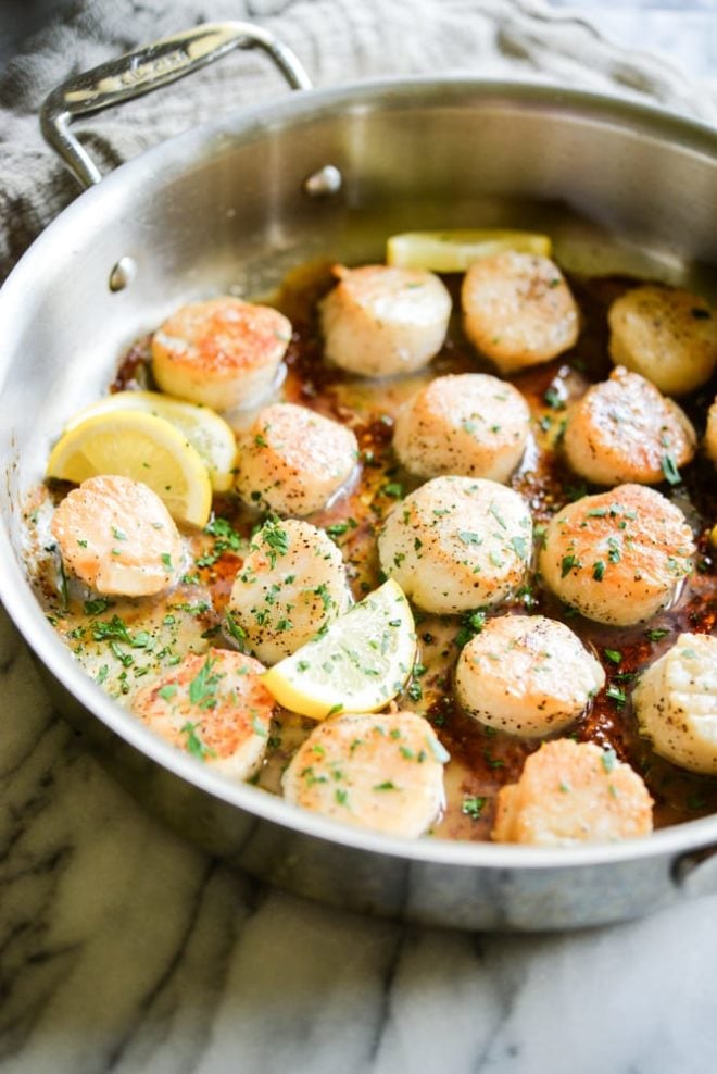 easy seared scallops in a stainless steel pan