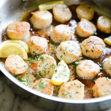easy seared scallops in a stainless steel pan