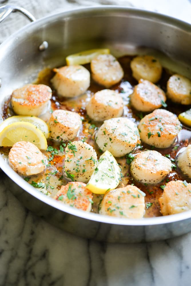easy seared scallops in a stainless steel pan