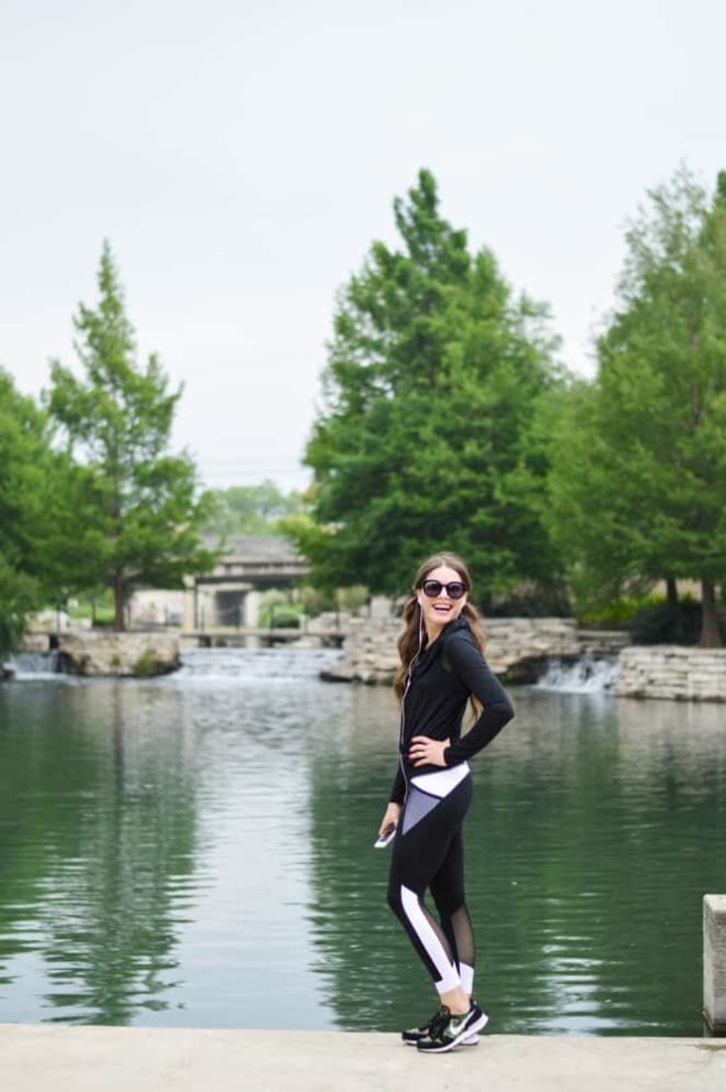 women in a fitness outfit in front of a river