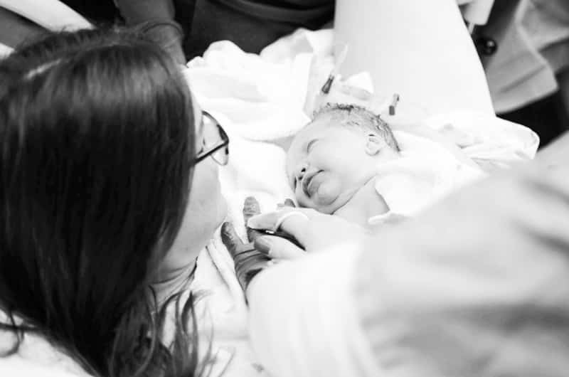 mother holding newborn