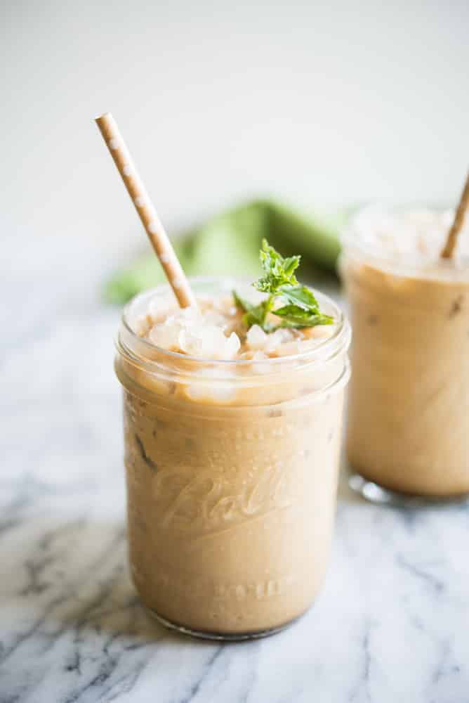 mint iced coffee with mint simple syrup in a mason jar