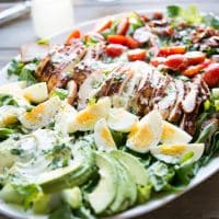 a plate of BBQ chicken Cobb salad with jalapeno ranch