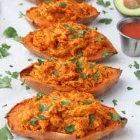 buffalo chicken twice baked sweet potatoes on a white serving platter