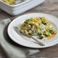 white plate of Cheesy Broccoli Casserole