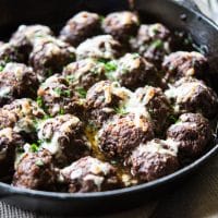 french onion skillet meatballs in a cast iron pan