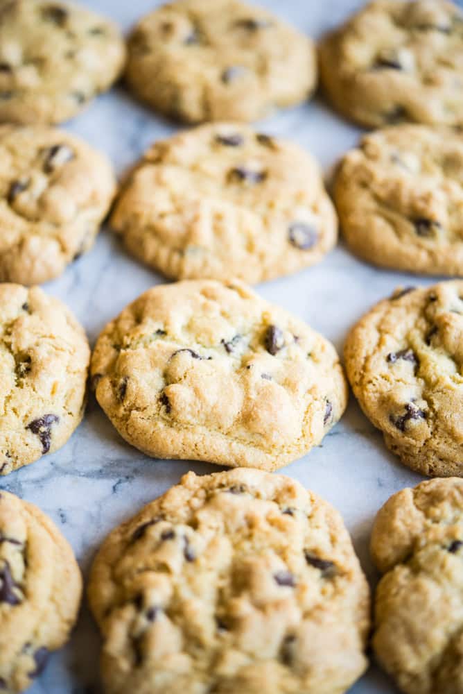 chewy gluten free chocolate chip cookies on a marble table