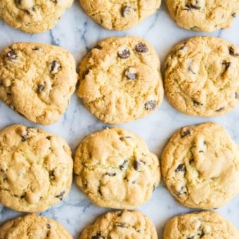 overhead view of chewy gluten free chocolate chip cookies on a marble table