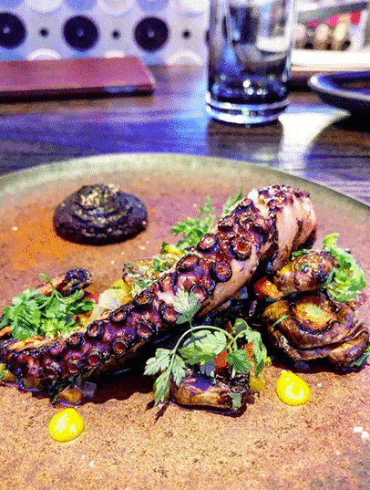 a plate of octopus at a restaurant