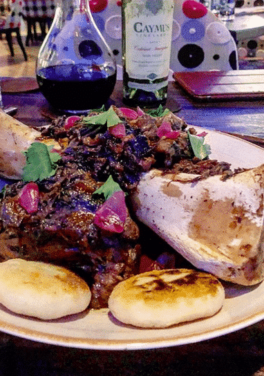 white plate piled high with a bone and marrow