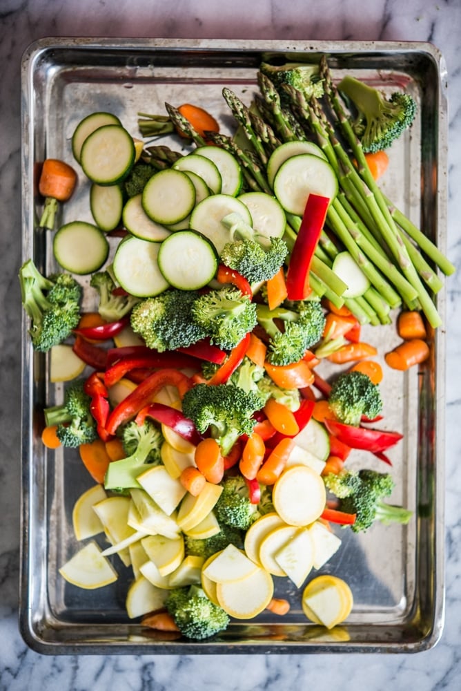 fresh vegetables on a sheet pan