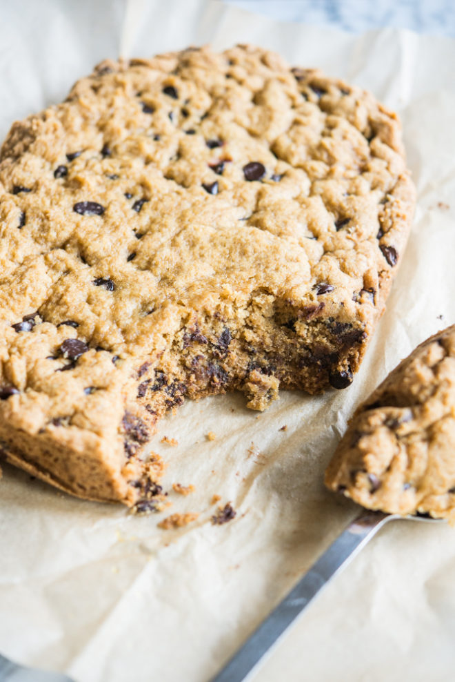 chocolate chip cookie cake on parchment paper