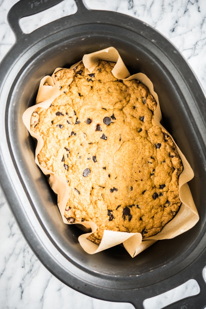 Gluten free chocolate chip cookie cake in a slow cooker