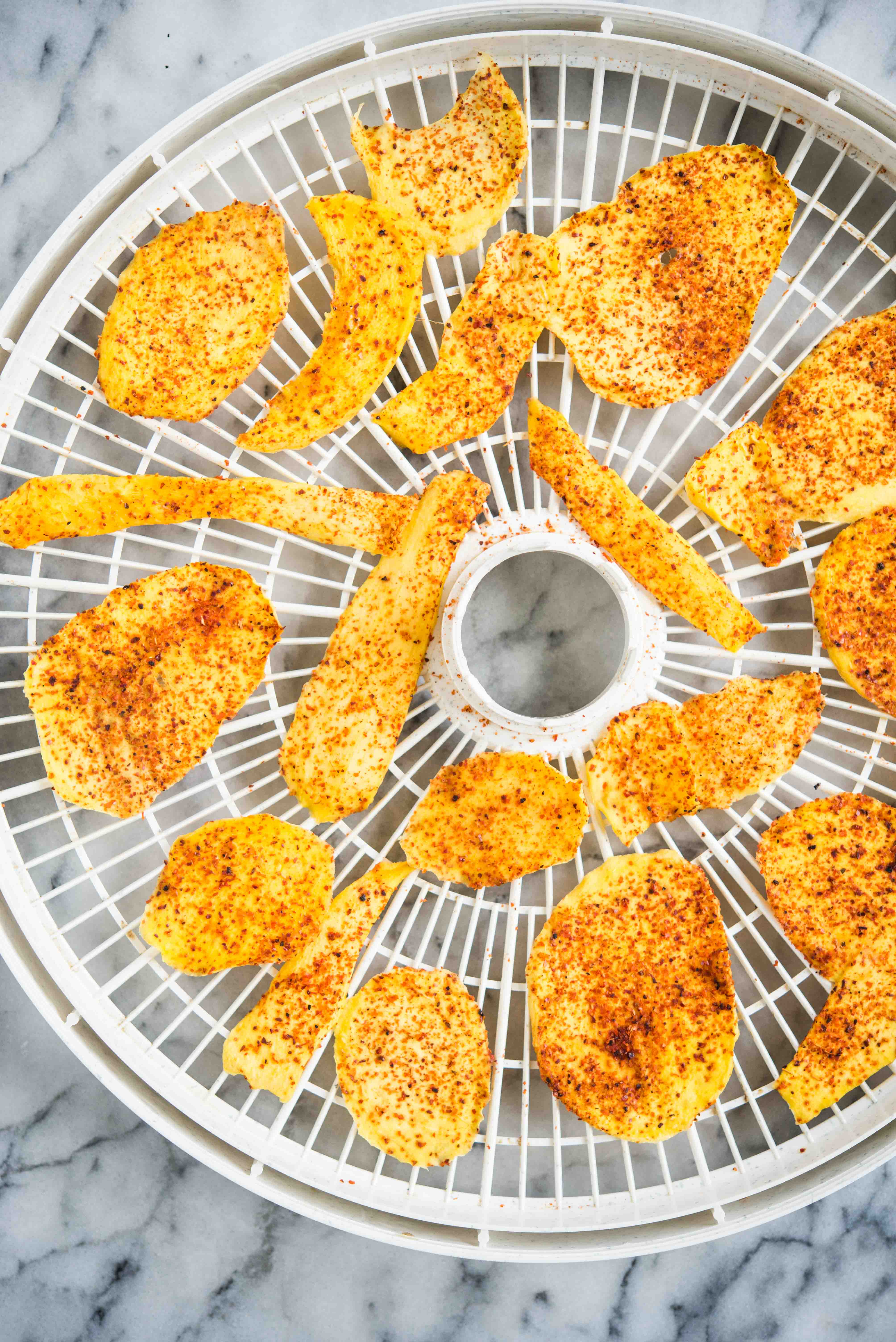 dried mango chili on a dehydrator