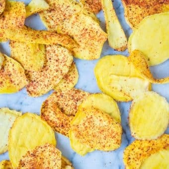 dried chili mango sprinkled with chili powder on a marble board