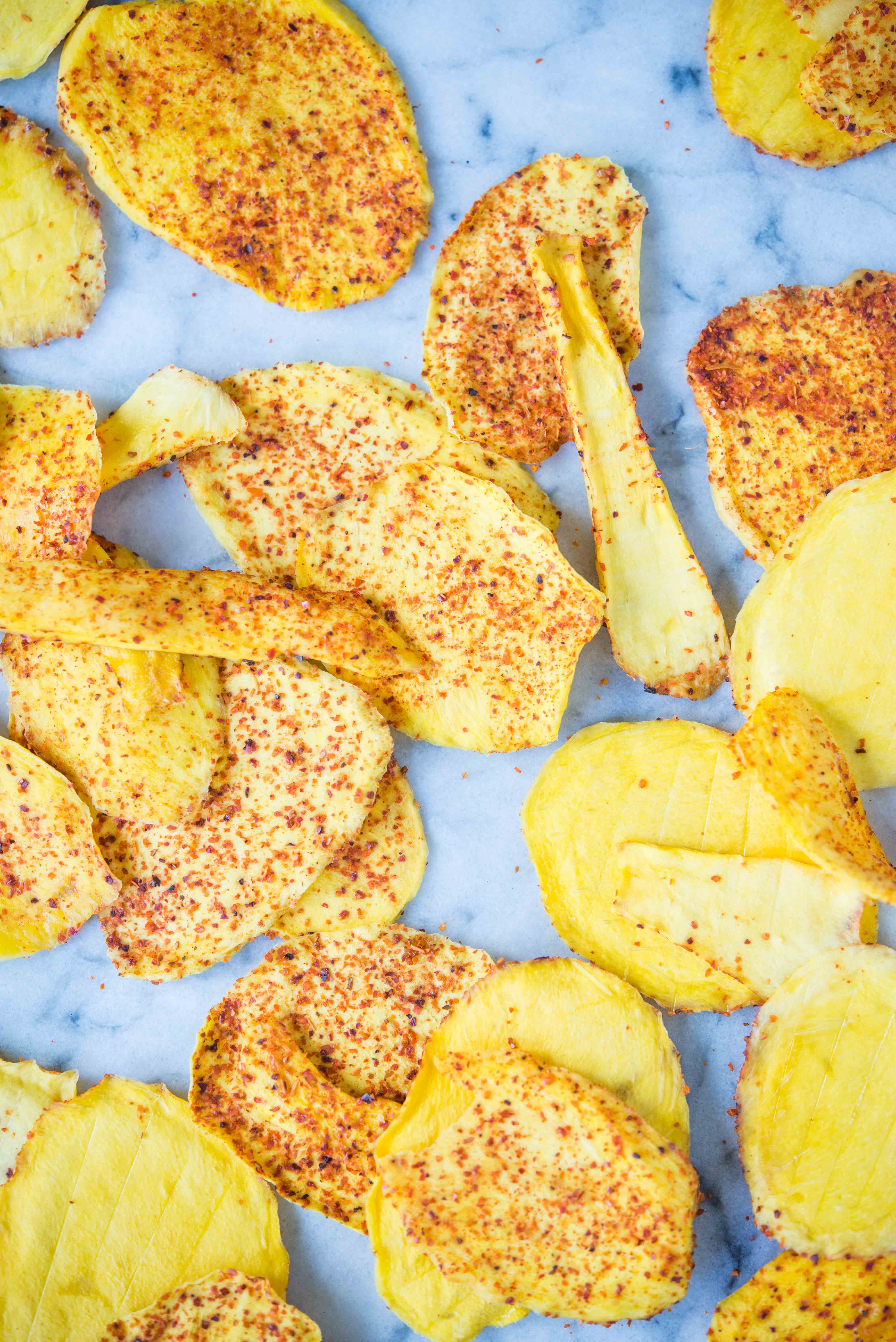 dried chili mango sprinkled with chili powder on a marble board