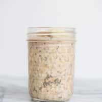 banana nut overnight oats in a mason jar on a marble board