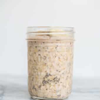 banana nut overnight oats in a mason jar on a marble board