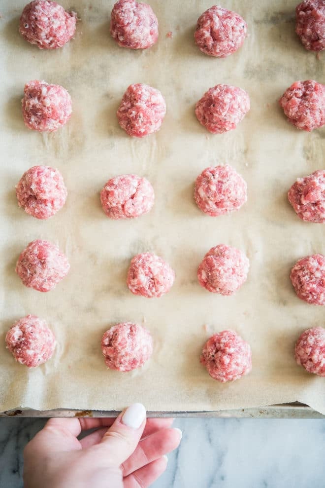 breakfast sausage meatballs on parchment paper
