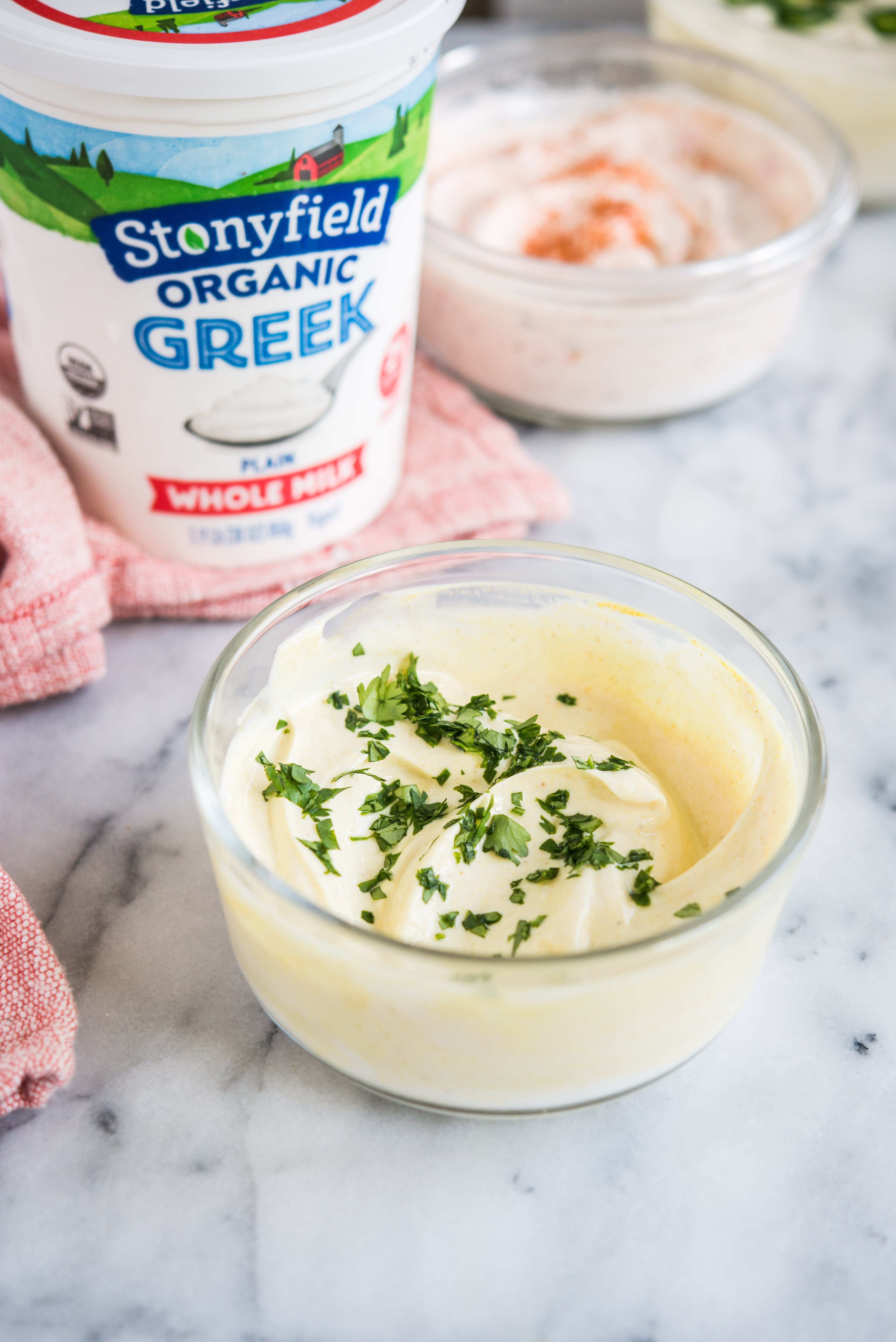 greek yogurt dip in a bowl on a marble countertop