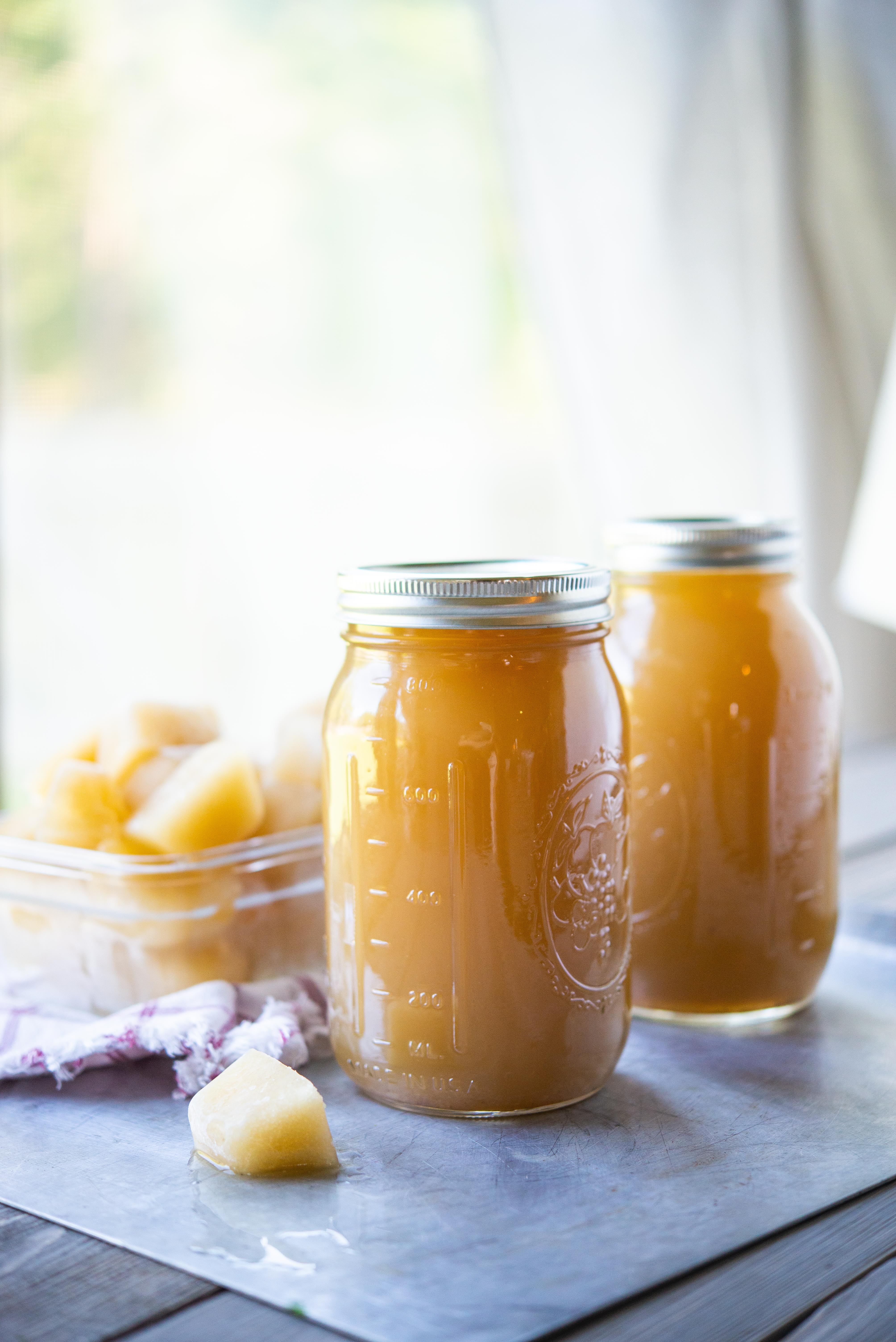 bone broth in a mason jar with bone broth cubes behind it