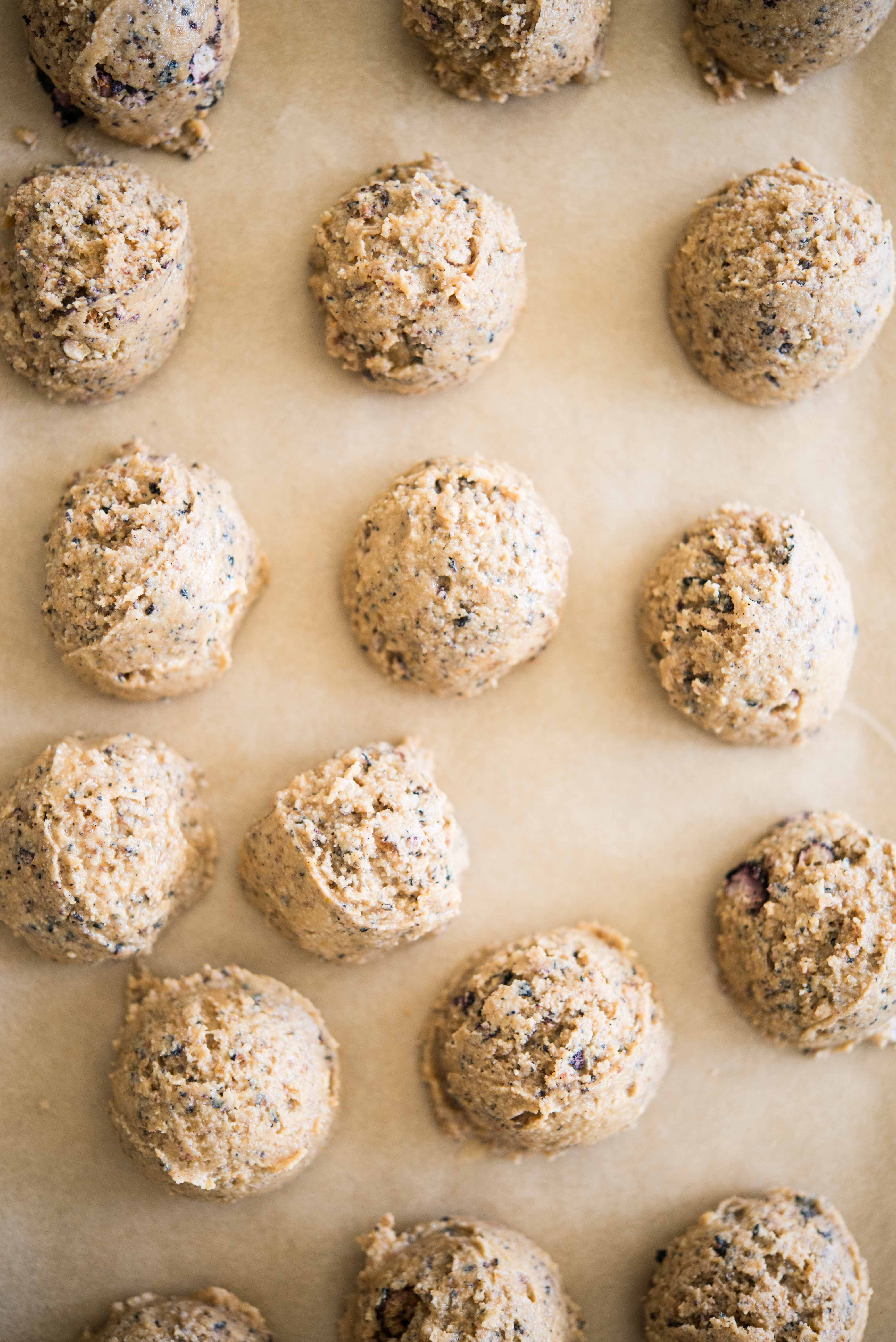 no-bake blueberry energy balls on parchment paper