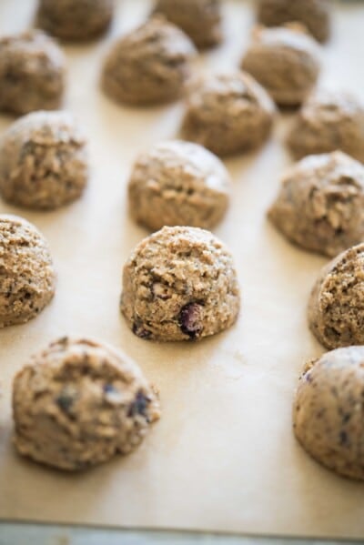 no-bake blueberry energy balls on parchment paper