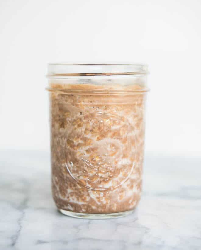 chocolate peanut butter overnight oats in a glass mason jar