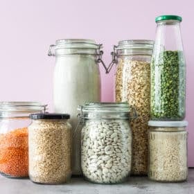 Variety of grains and legumes in glass jars